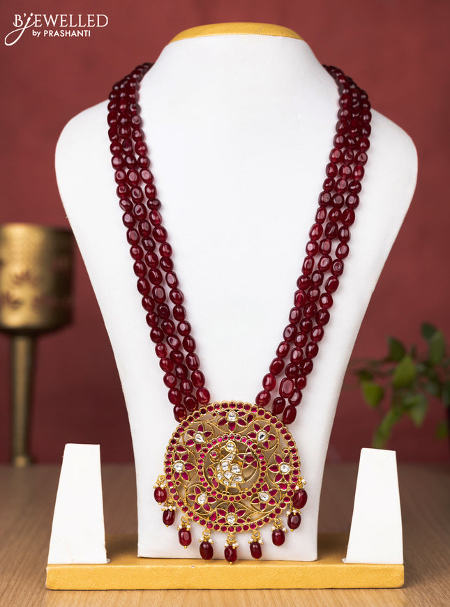 Jadau beaded maroon haaram peacock and floral pendant with jadau pink & kundan stones and pearl & beads hanging without earrings