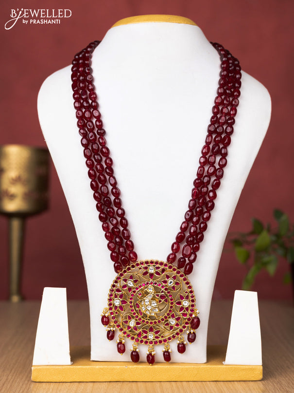 Jadau beaded maroon haaram peacock and floral pendant with jadau pink & kundan stones and pearl & beads hanging without earrings