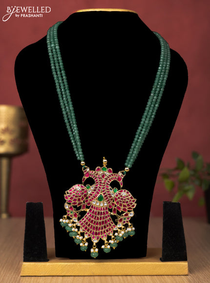 Jadau beaded green haaram gandaberunda pendant with jadau kundan stones and pearl & natural beads hanging without earrings