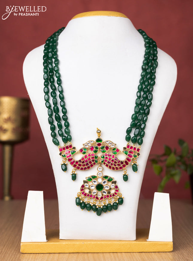 Jadau beaded green haaram matsya pendant with jadau kundan stones and pearl & beads hanging without earrings