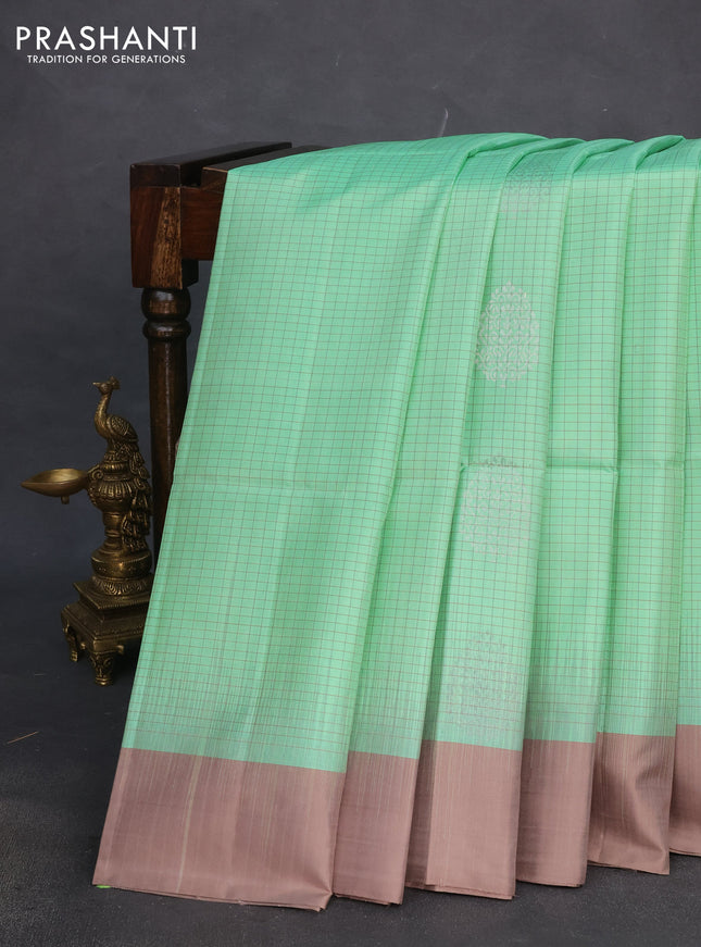 Pure soft silk saree teal green shade and pastel brown with allover checks & silver zari woven buttas and simple border