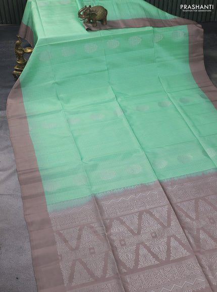 Pure soft silk saree teal green shade and pastel brown with allover checks & silver zari woven buttas and simple border