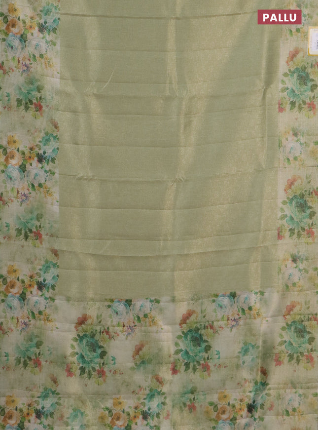 Tissue saree mild pista green with allover zari weaves and floral digital printed border