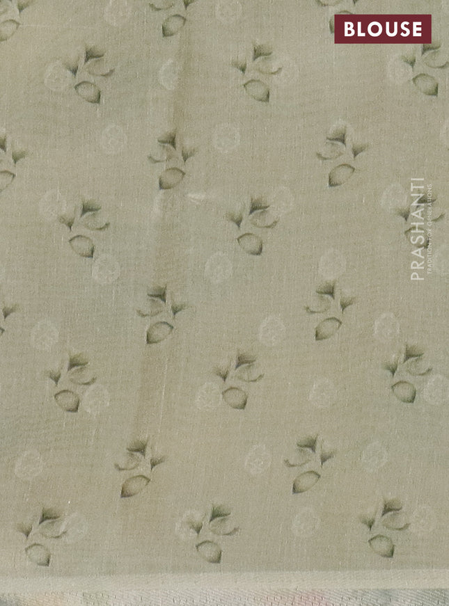 Tissue saree mild pista green with allover zari weaves and floral digital printed border