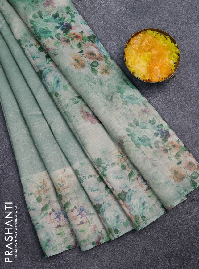 Tissue saree pastel blue with allover zari weaves and floral digital printed border