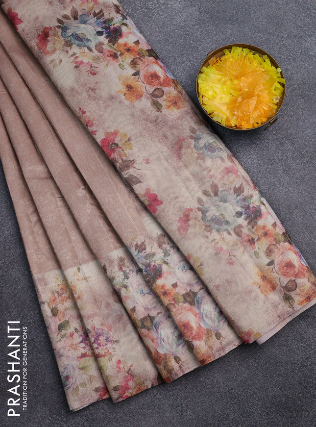 Tissue saree mild peach with allover zari weaves and floral digital printed border