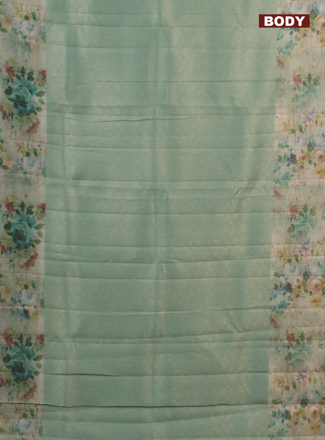 Tissue saree teal green shade with allover zari weaves and floral digital printed border
