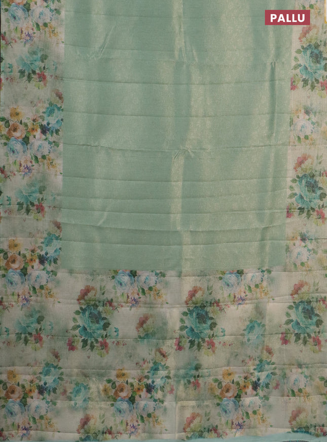 Tissue saree teal green shade with allover zari weaves and floral digital printed border