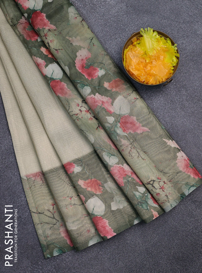 Tissue saree pastel pista green and green with allover zari weaves and floral digital printed border