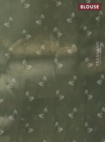 Tissue saree pastel pista green and green with allover zari weaves and floral digital printed border