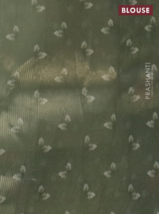 Tissue saree pastel pista green and green with allover zari weaves and floral digital printed border