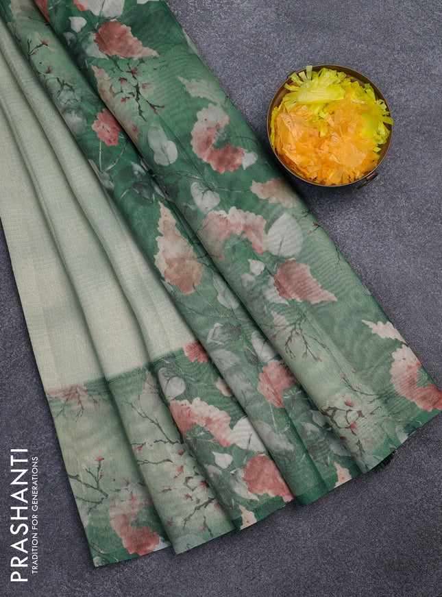Tissue saree pastel green and green with allover zari weaves and floral digital printed border