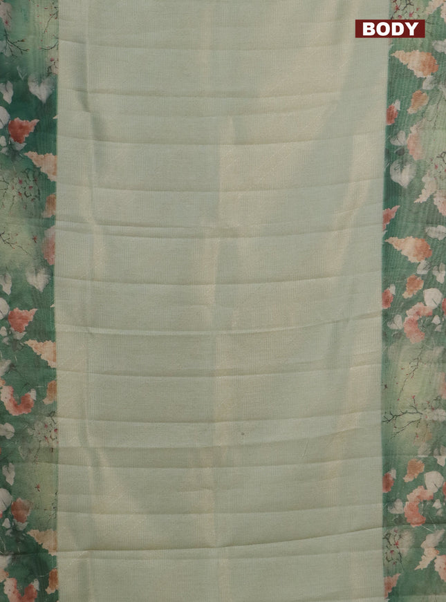 Tissue saree pastel green and green with allover zari weaves and floral digital printed border