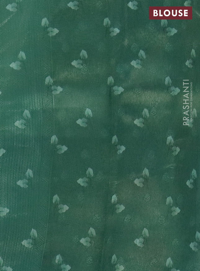 Tissue saree pastel green and green with allover zari weaves and floral digital printed border