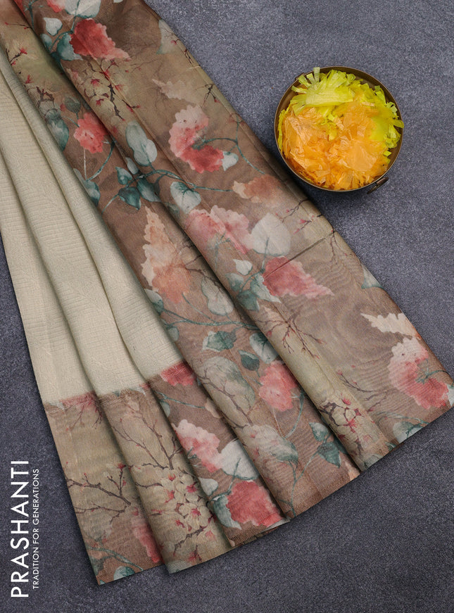 Tissue saree cream and sandal with allover zari weaves and floral digital printed border