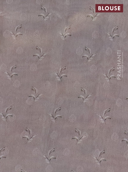 Tissue saree mild lavender and grey with allover zari weaves and floral digital printed border