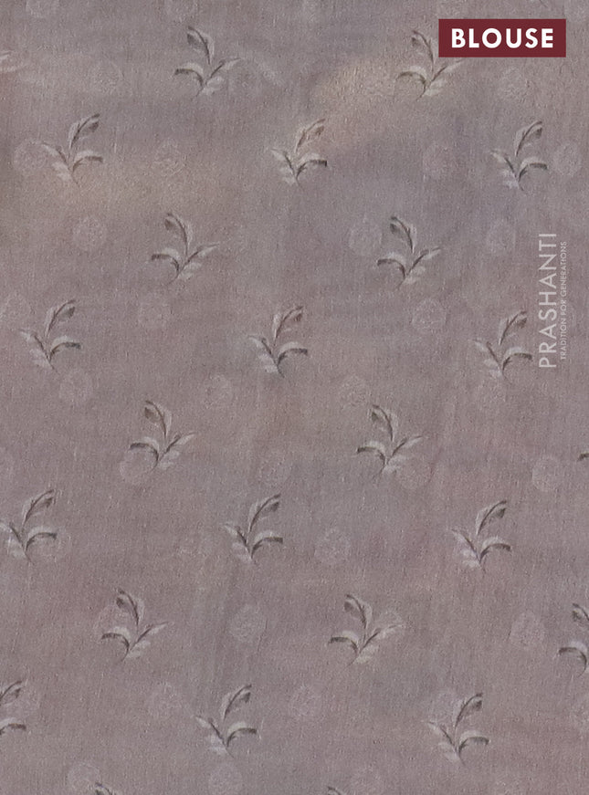 Tissue saree mild lavender and grey with allover zari weaves and floral digital printed border