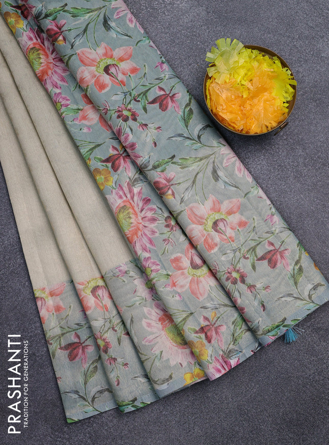 Tissue saree pista green and light blue with allover zari weaves and floral digital printed border