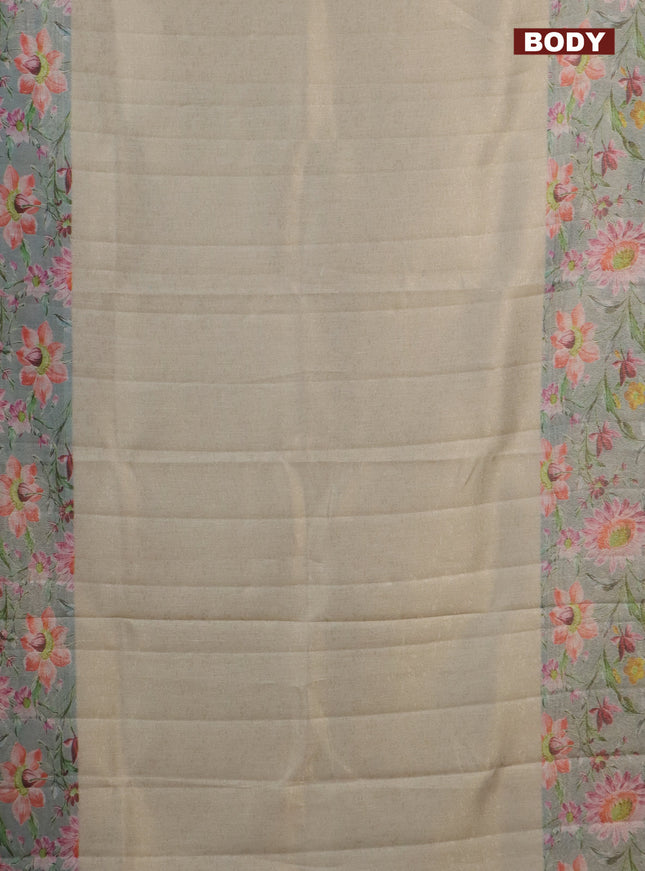 Tissue saree pista green and light blue with allover zari weaves and floral digital printed border