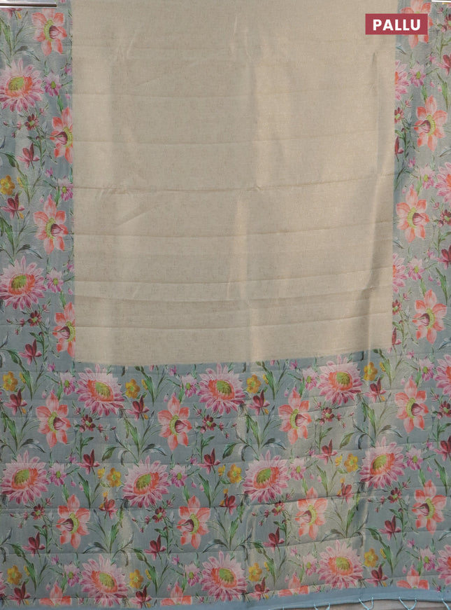 Tissue saree pista green and light blue with allover zari weaves and floral digital printed border