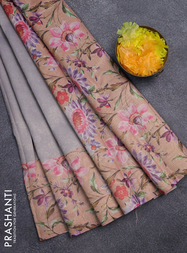 Tissue saree grey and peach orange with allover zari weaves and floral digital printed border