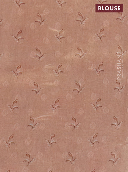 Tissue saree grey and peach orange with allover zari weaves and floral digital printed border