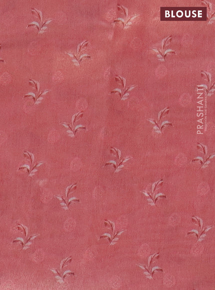 Tissue saree light blue and peach pink with allover zari weaves and floral digital printed border