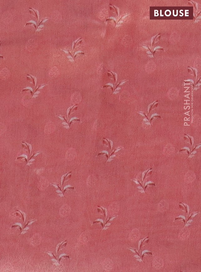 Tissue saree light blue and peach pink with allover zari weaves and floral digital printed border