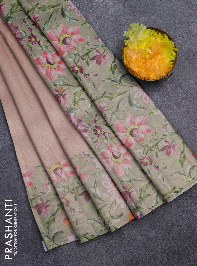 Tissue saree pastel peach and green with allover zari weaves and floral digital printed border