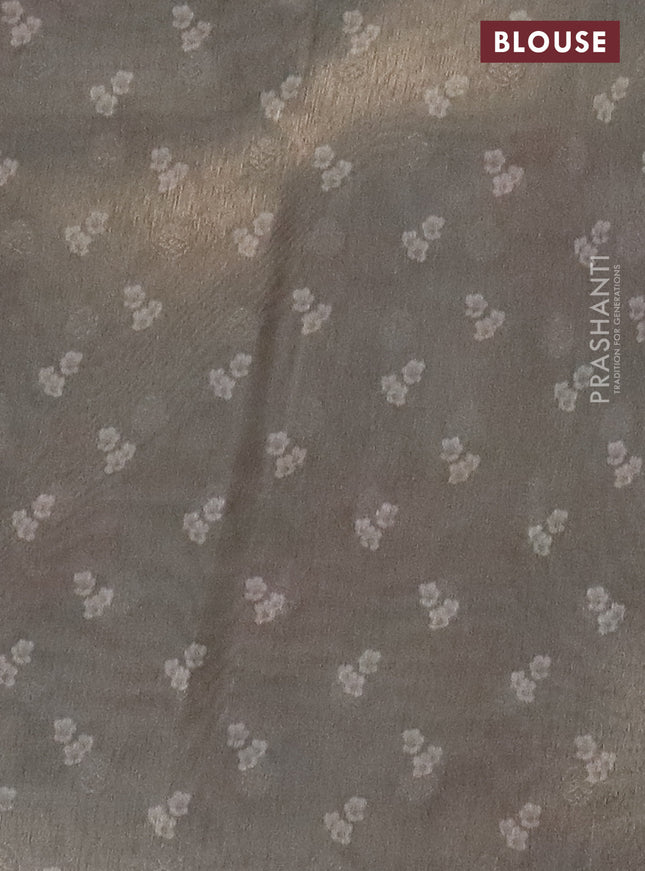 Tissue saree pastel grey with allover zari weaves and floral digital printed border