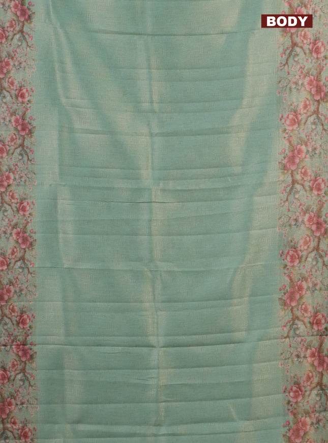 Tissue saree teal green shade with allover zari weaves and floral digital printed border