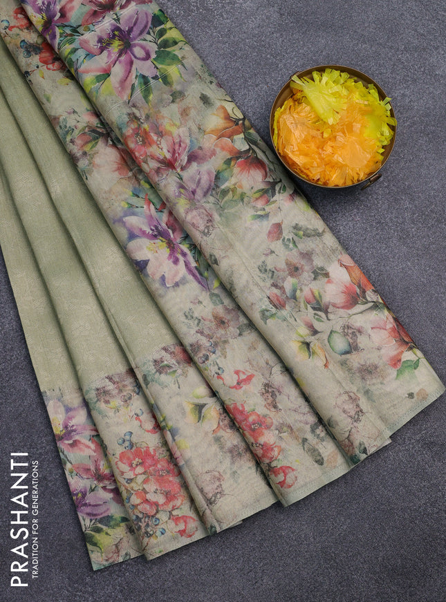 Tissue saree pista green with allover zari weaves and floral digital printed border