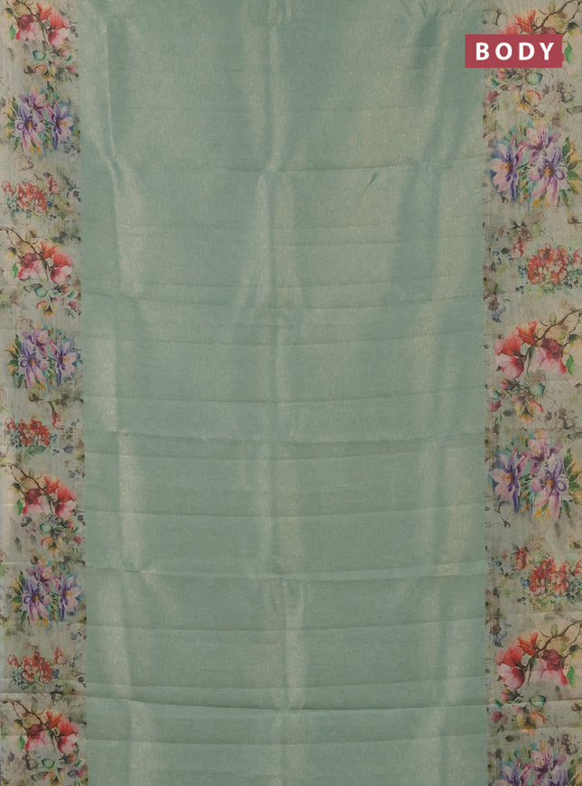 Tissue saree teal green shade with allover zari weaves and floral digital printed border