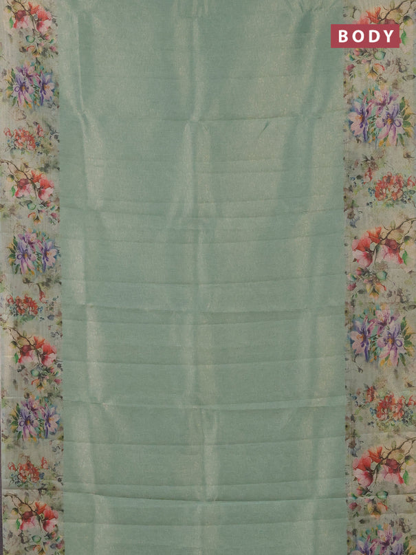 Tissue saree teal green shade with allover zari weaves and floral digital printed border
