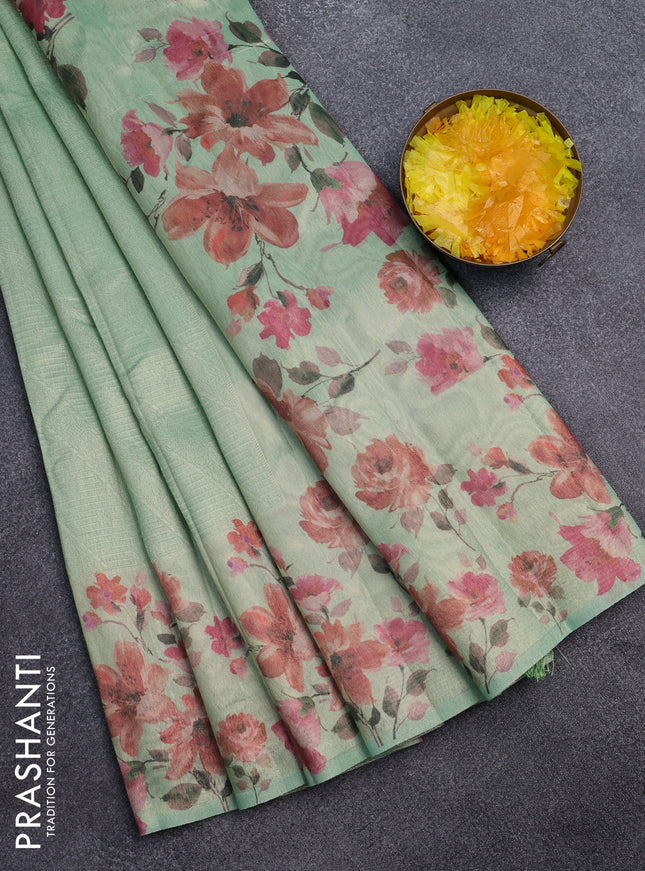 Tissue saree pastel green with allover zari weaves and floral digital printed border