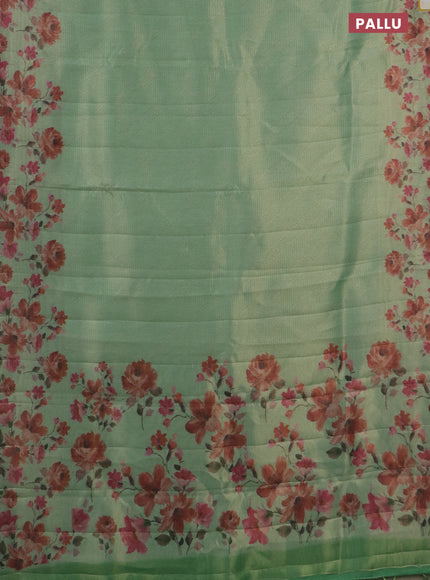 Tissue saree pastel green with allover zari weaves and floral digital printed border