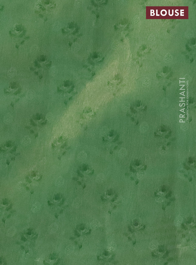 Tissue saree pastel green with allover zari weaves and floral digital printed border