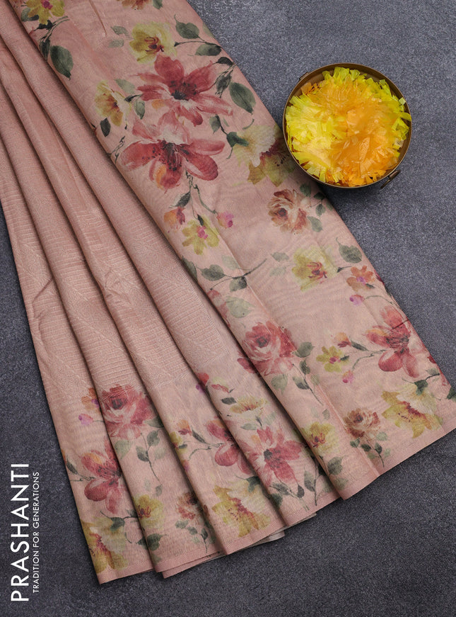 Tissue saree peach shade with allover zari weaves and floral digital printed border