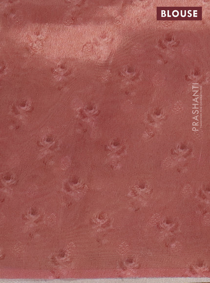 Tissue saree peach shade with allover zari weaves and floral digital printed border