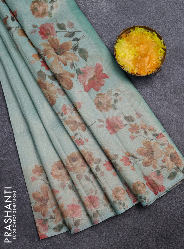 Tissue saree pastel blue with allover zari weaves and floral digital printed border