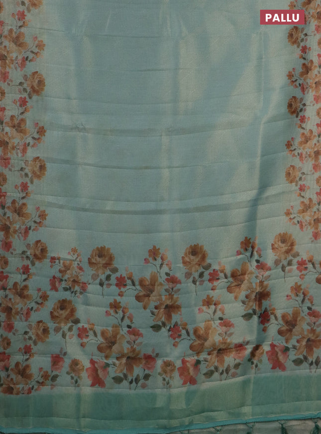 Tissue saree pastel blue with allover zari weaves and floral digital printed border