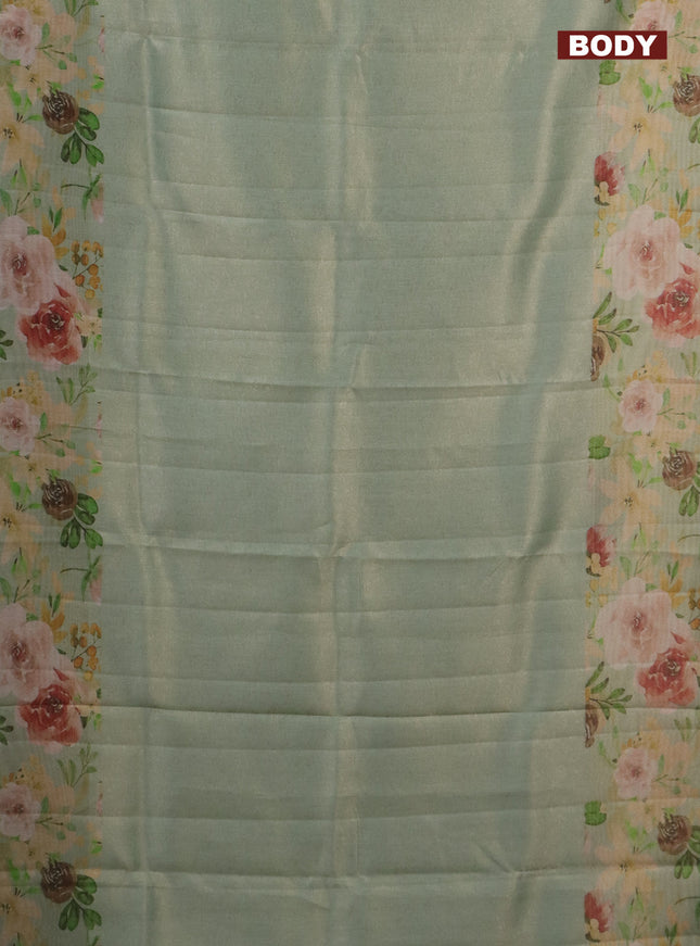 Tissue saree pastel green with allover zari weaves and floral digital printed border