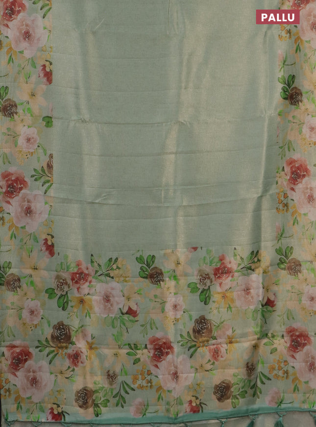 Tissue saree pastel green with allover zari weaves and floral digital printed border