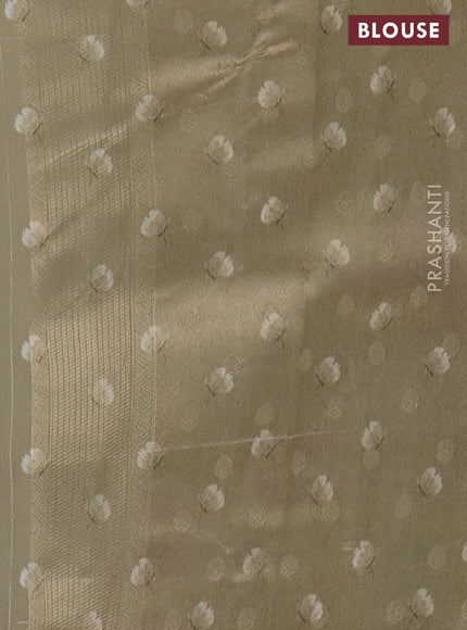 Tissue saree beige with allover zari weaves and floral digital printed border