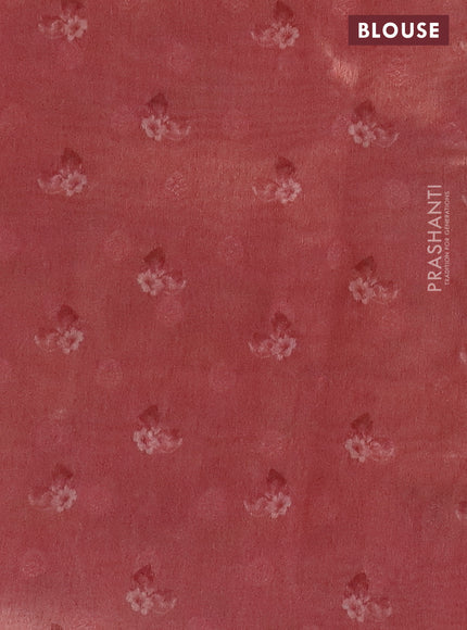 Tissue saree pastel blue and peach pink with allover zari weaves and floral digital printed border