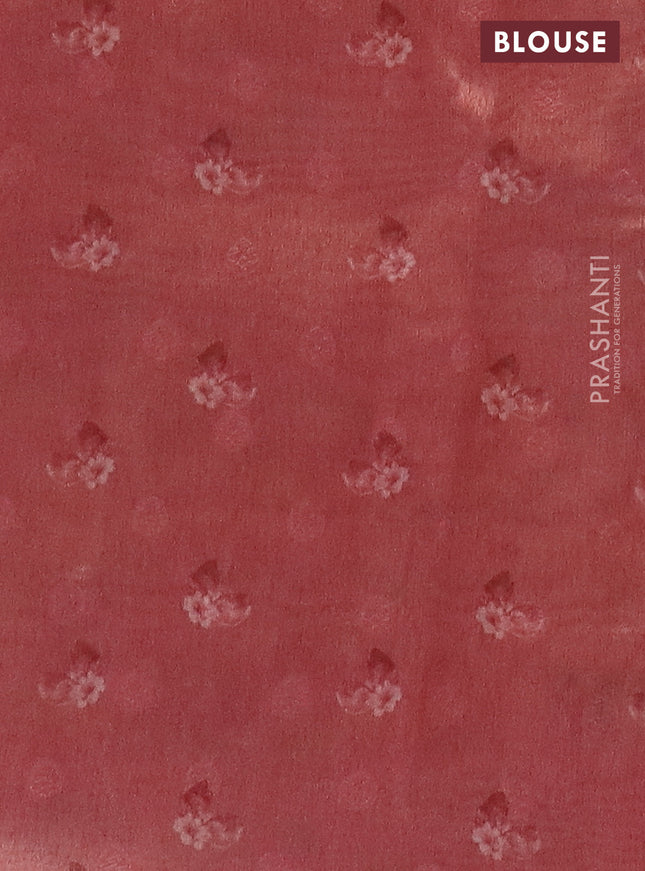 Tissue saree pastel blue and peach pink with allover zari weaves and floral digital printed border