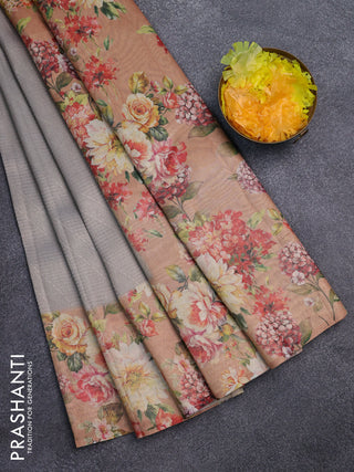 Tissue saree pastel grey and peach shade with allover zari weaves and floral digital printed border