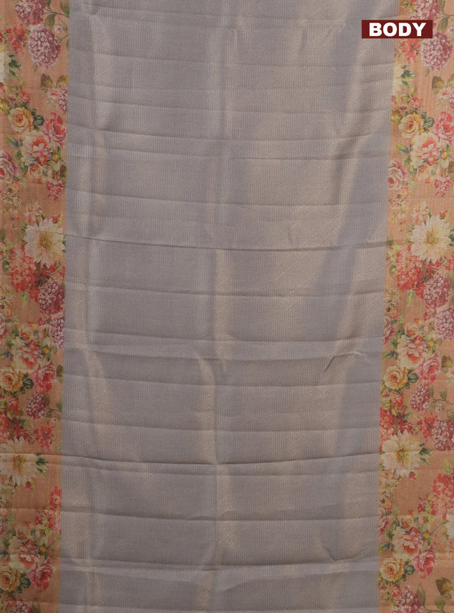Tissue saree pastel grey and peach shade with allover zari weaves and floral digital printed border