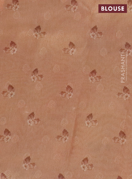 Tissue saree pastel grey and peach shade with allover zari weaves and floral digital printed border