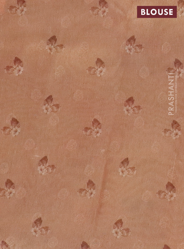 Tissue saree pastel grey and peach shade with allover zari weaves and floral digital printed border